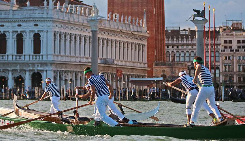 rowers and gondolas at a regatta, Venice