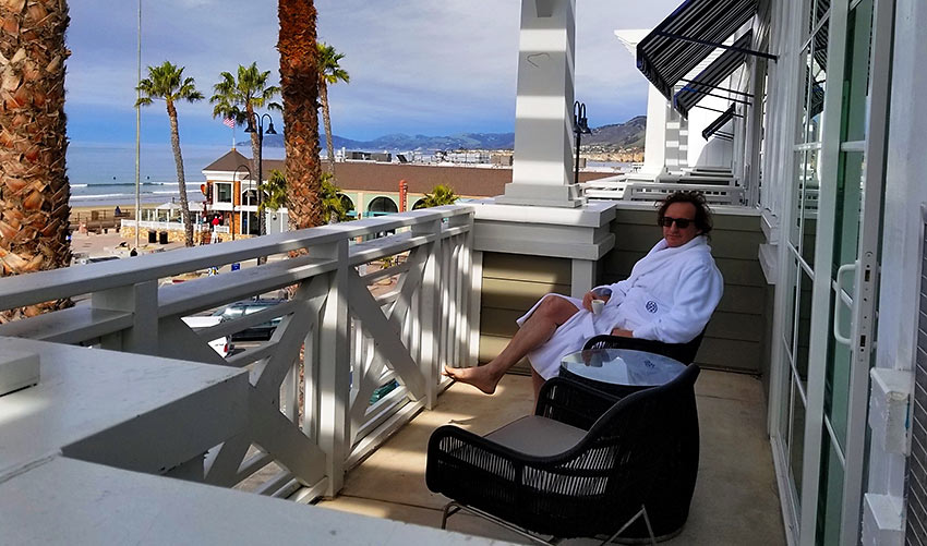 the writer enjoying a view of the Pacific Ocean from his room at the Inn at the Pier