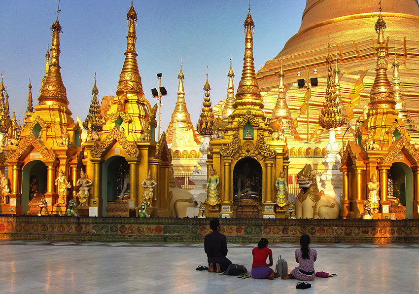 Burmese praying at pagoda