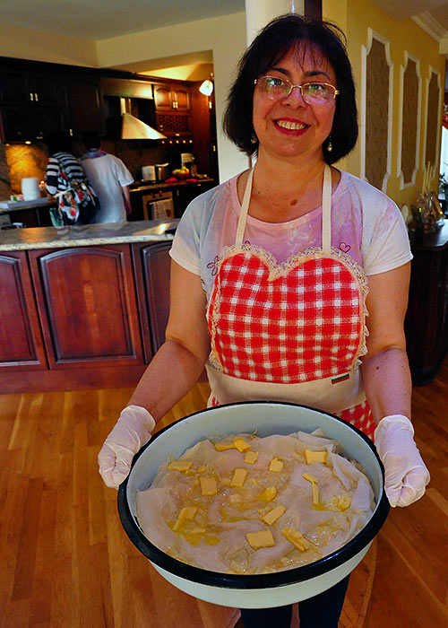 Ramona Mihaylova demonstrating how to make banitsa in her home in Bulgaria