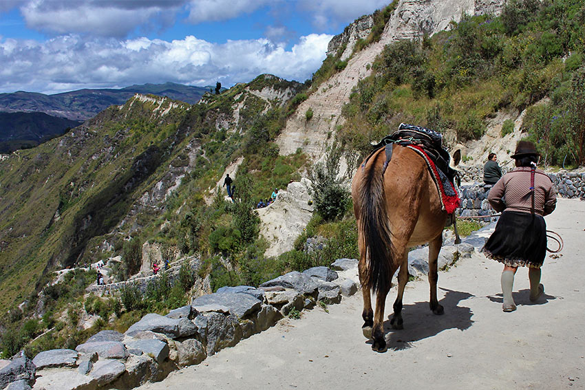 local guide in traditional garb provides horseback rides