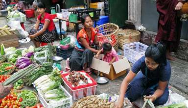 selling vegetables at a local market in Myanmar