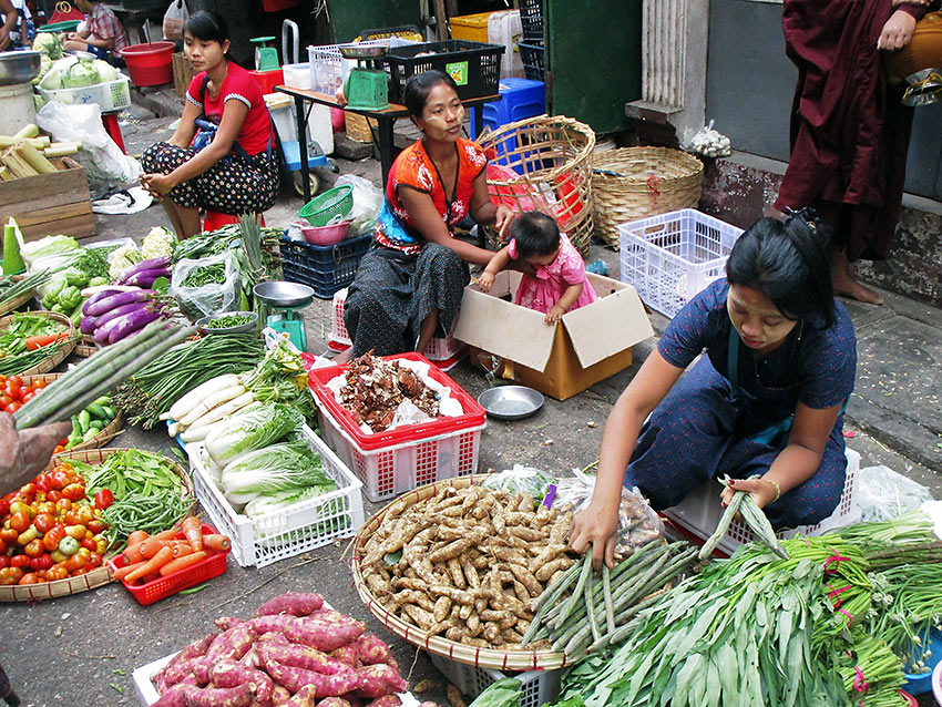 selling vegetables at a local market in Myanmar