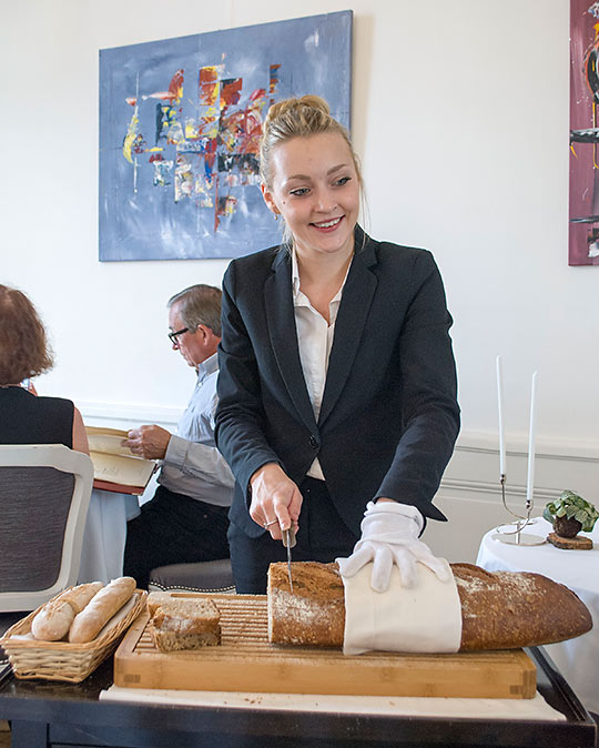 preparing bread at Le Gabriel restaurant