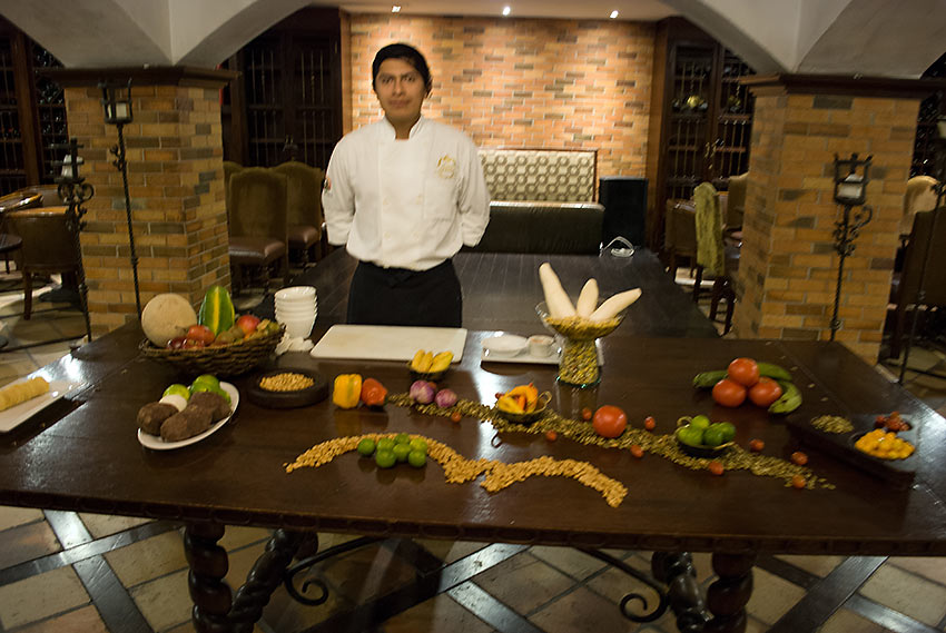 Assistant Che, Christian Pilajo, presenting a cooking demonstration of classic Ecuadorian cuisine at Plaza Grande Hotel, Quito