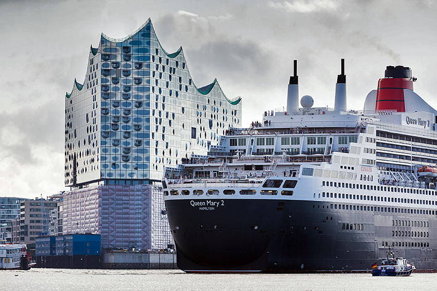 Cunard's Queen Mary 2 docked near the Elbphilharmonie, Hamburg