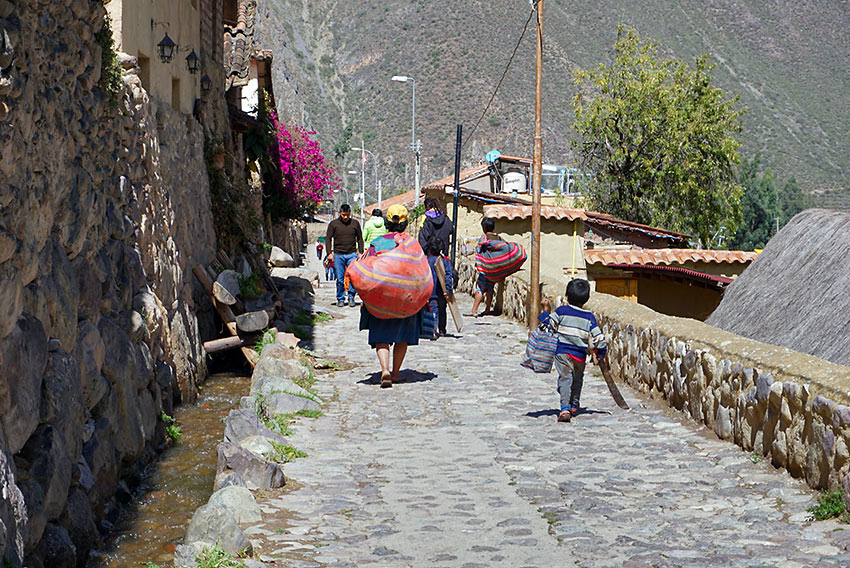 a street at Ollantaytambo with its Incan canal