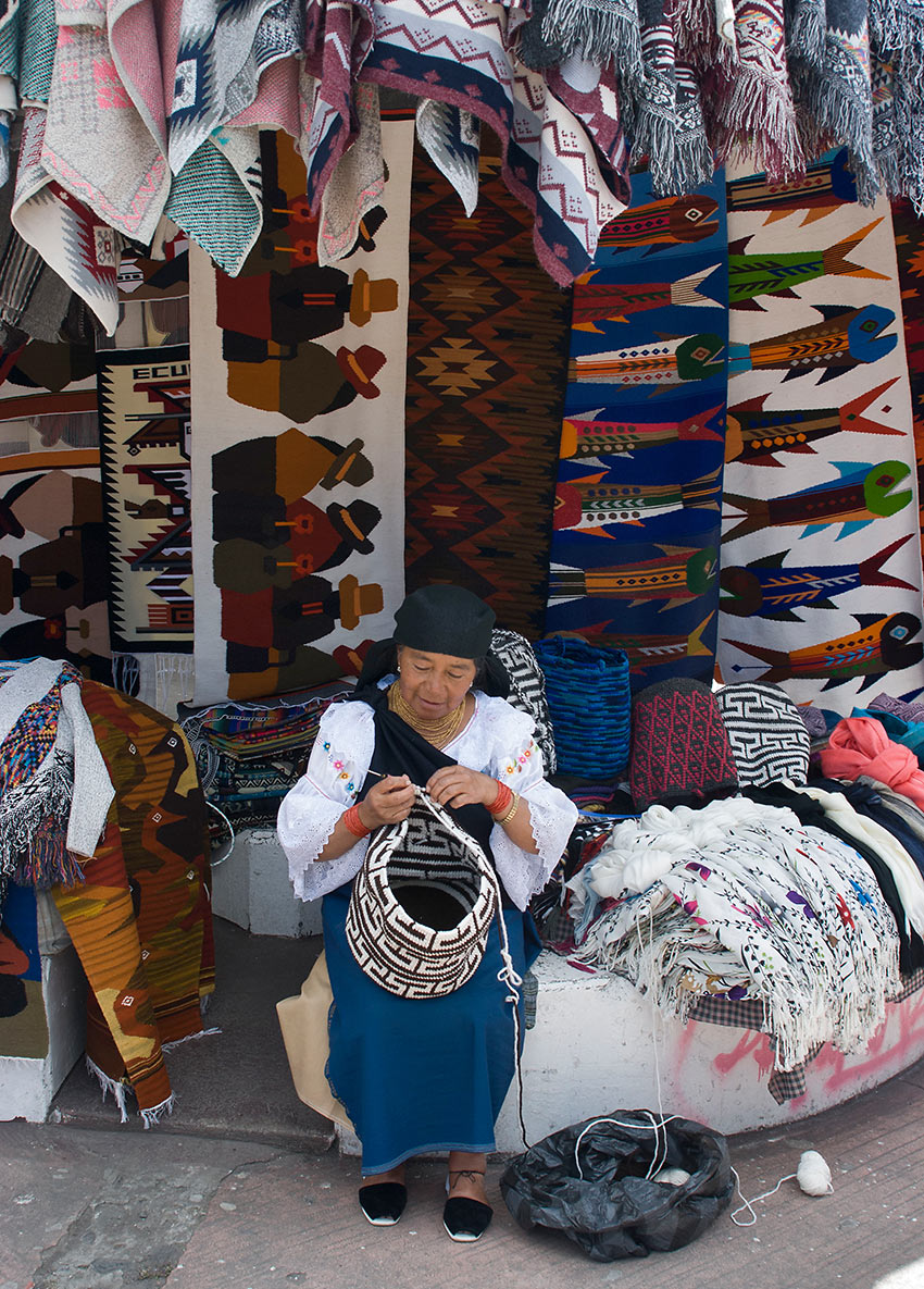 a weaver at her store, Otavalo Craft Market, Quito