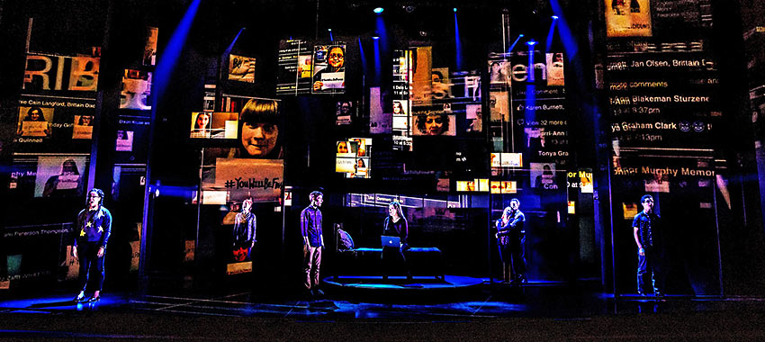 the Company of "Dear Evan Hansen” with Peter Nigrini’s projection design of internet chatter in the background