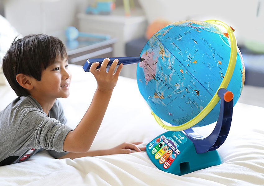 child with GeoSafari JR. Talking Globe