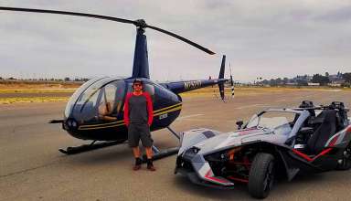 writer with helicopter and Polaris Slingshot at Oceanside