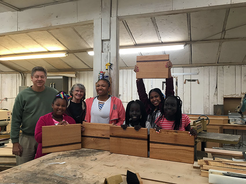 the Landrys with girls and their cutting boards, Kids Are People program