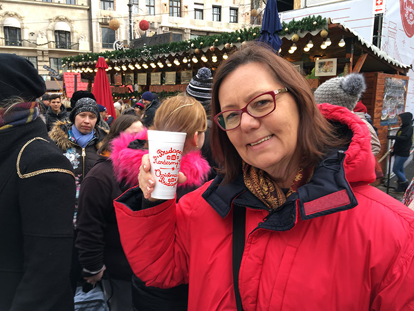 author with mulled wine at a Christmas market in Budapest, Hungary