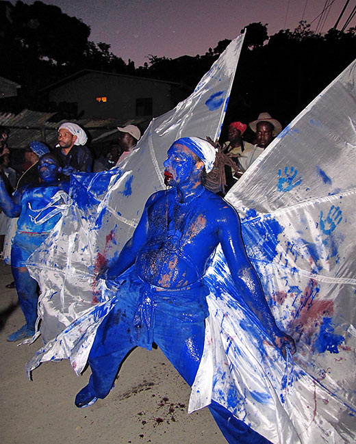 blue devil at a J’ouvert carnival street party