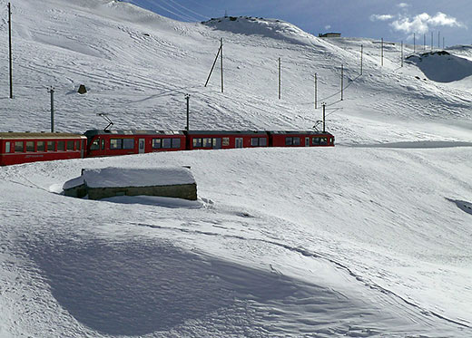 Glacier Express train in winter landscape