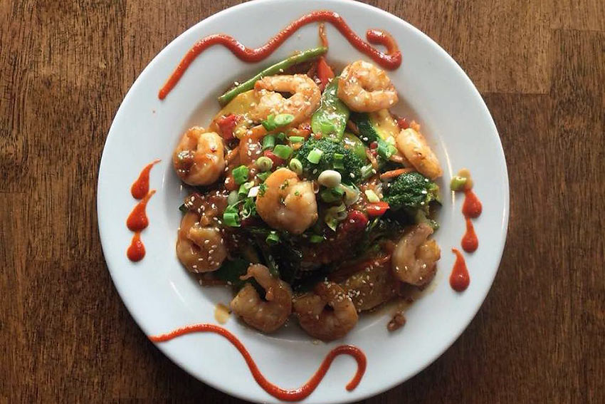 sautéed shrimp and fresh vegetables in a Thai peanut sauce served over jasmine rice