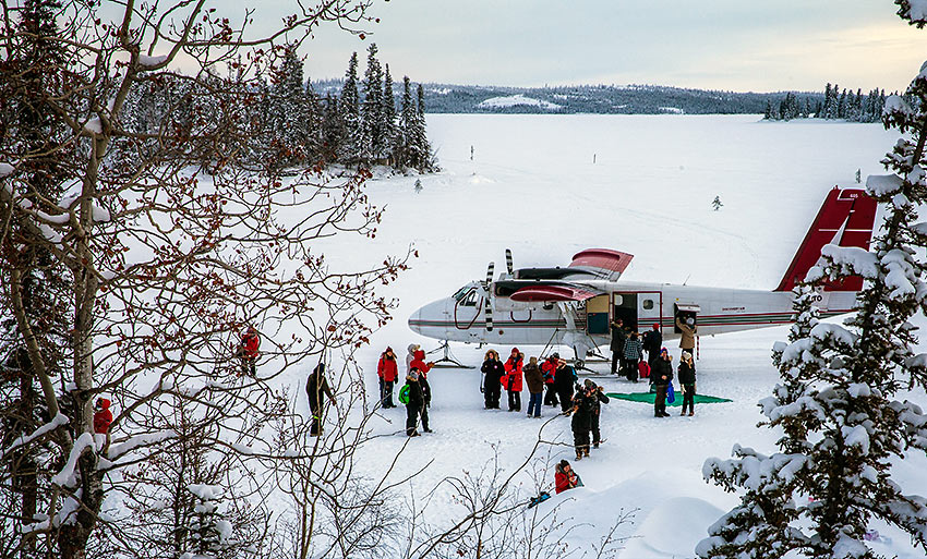 Twin Otter plane with departing and arriving guests, Blachford Lake