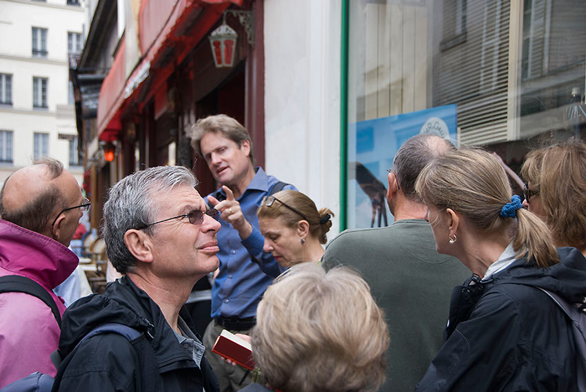 tourists with guide at a Paris Walking Tour