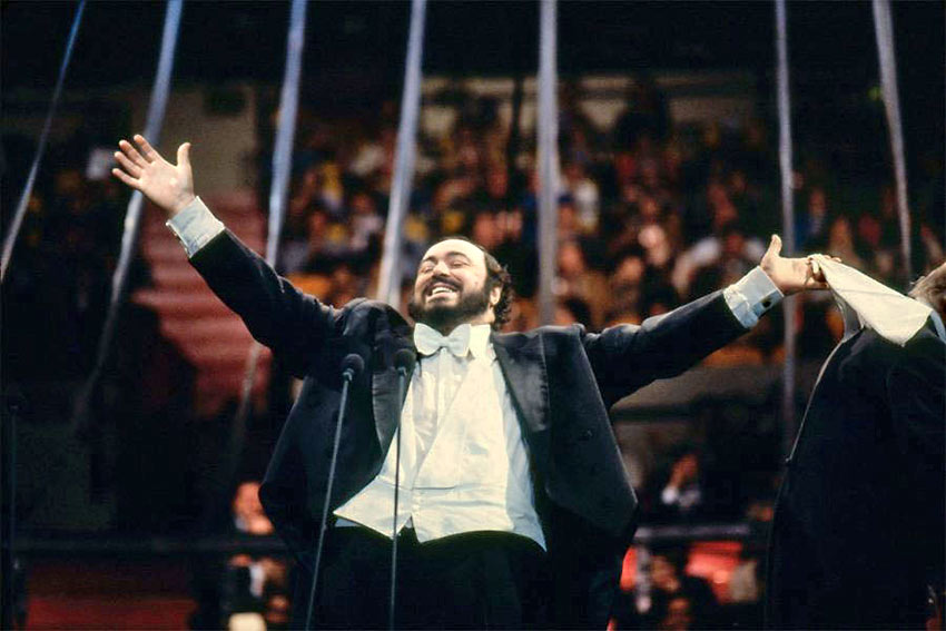 Pavarotti in performance with his signature white handkerchief