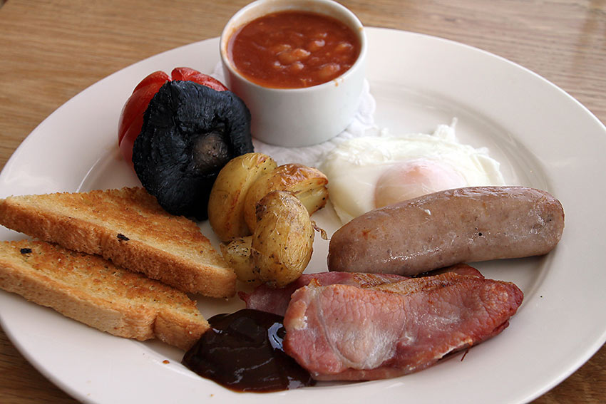 full Welsh Breakfast: eggs, sausage, beans, back bacon, grilled tomatoes and mushrooms, potatoes, fried bread and laverbread