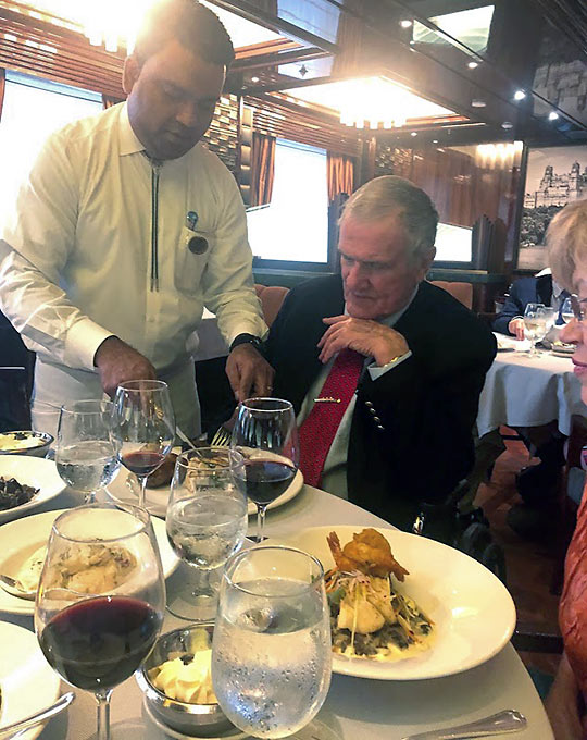 author John Clayton given a demonstration on the use of a carving knife