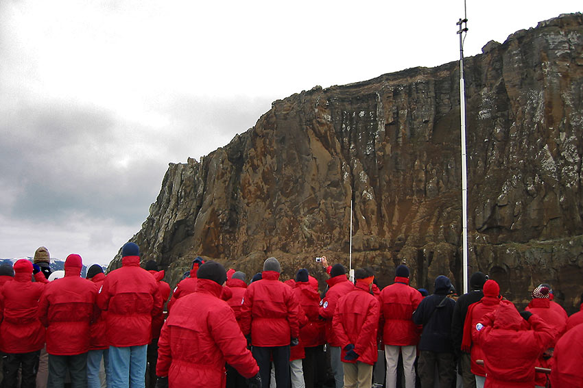 Antarctica tour guests in complementary red parkas