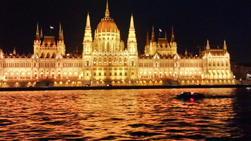 Budapest skyline at night viewed from cruise ship on the Danube