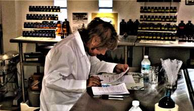 writer in lab coat at The Parfumerie, St. Martin