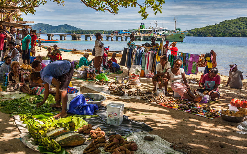 locals at a market near a pier