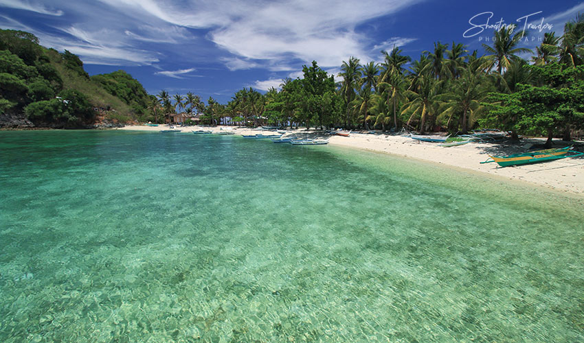 coral reef off a beach at Alas Island