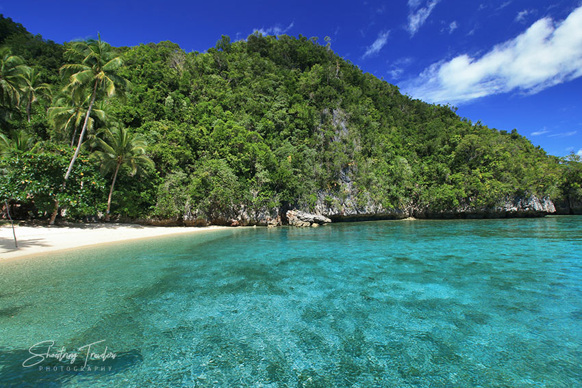 beach and karst cliffs at Babas Cove