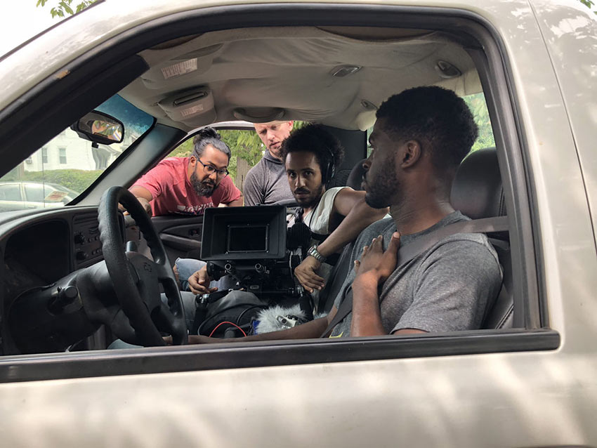 Merawi Gerima (filmmaker) unidentified crew member, Mark Jeevaratnam (cinematographer) and Obinna Nwachukwu