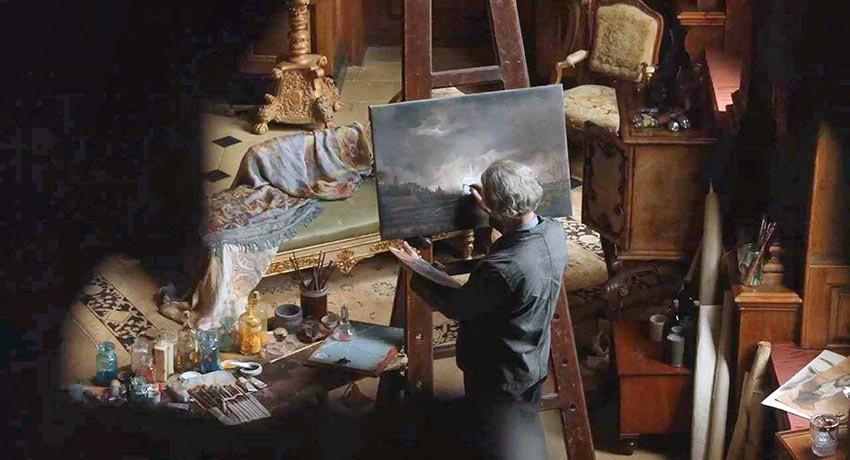 Han Van Meegeren (Guy Pierce) at work in his studio