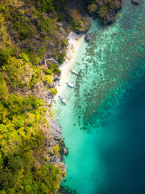 drone shot of Hidden Beach, Matinloc Island, El Nido