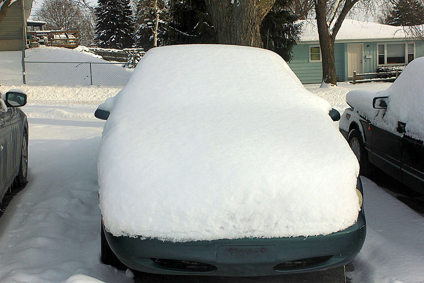 snow-covered car in Maine